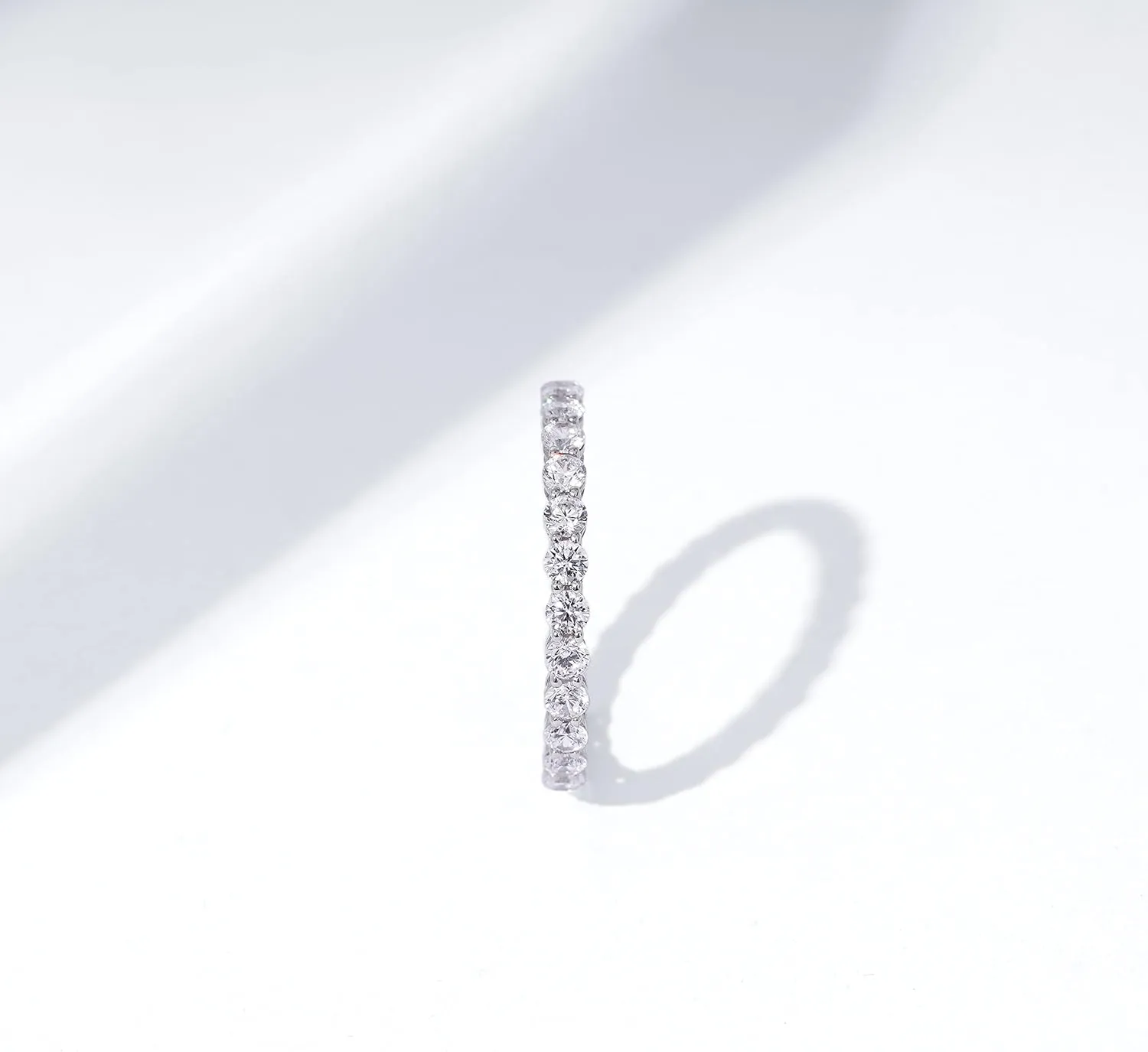 Amazon Essentials Platinum or Gold Plated Sterling Silver All-Around Band Ring set with Round Infinite Elements Cubic Zirconia (previously Amazon Collection)