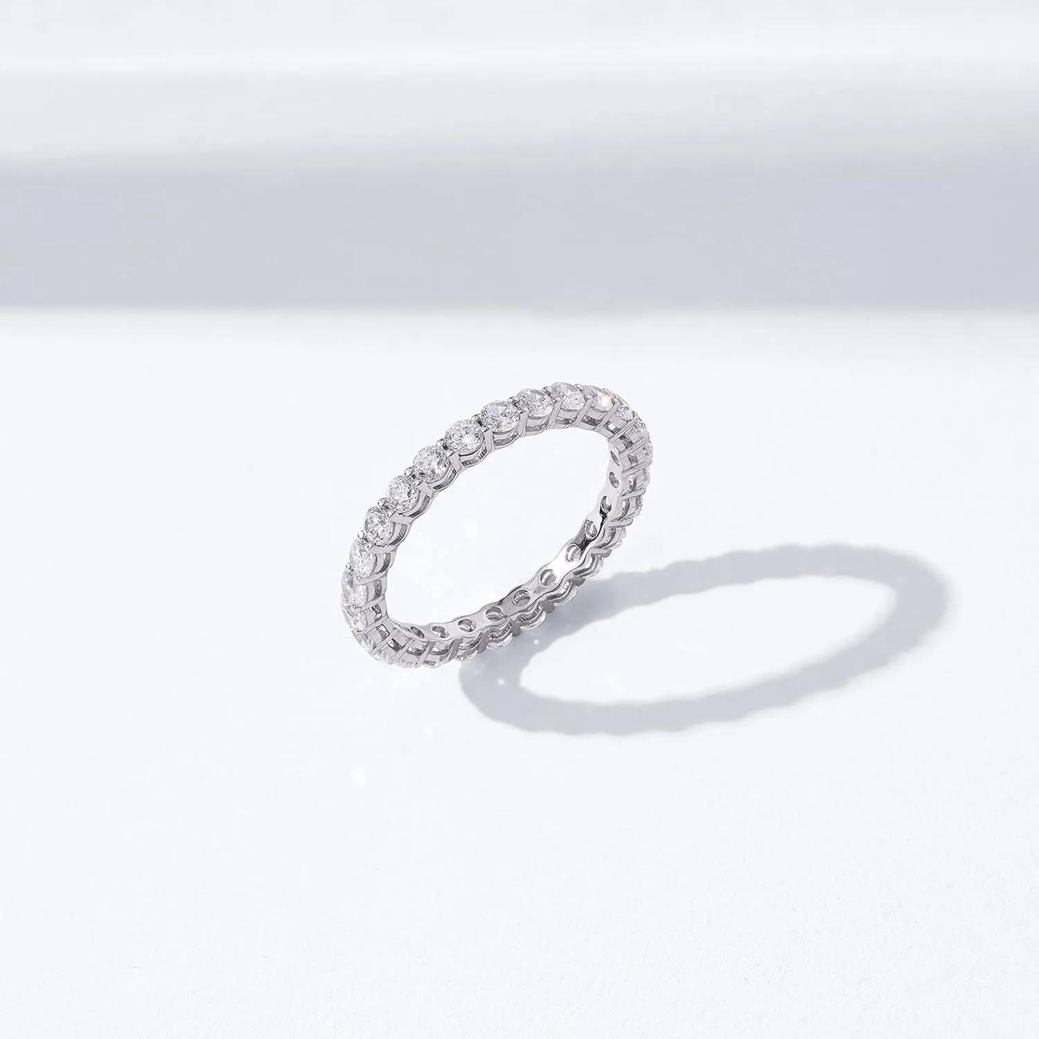 Amazon Essentials Platinum or Gold Plated Sterling Silver All-Around Band Ring set with Round Infinite Elements Cubic Zirconia (previously Amazon Collection)