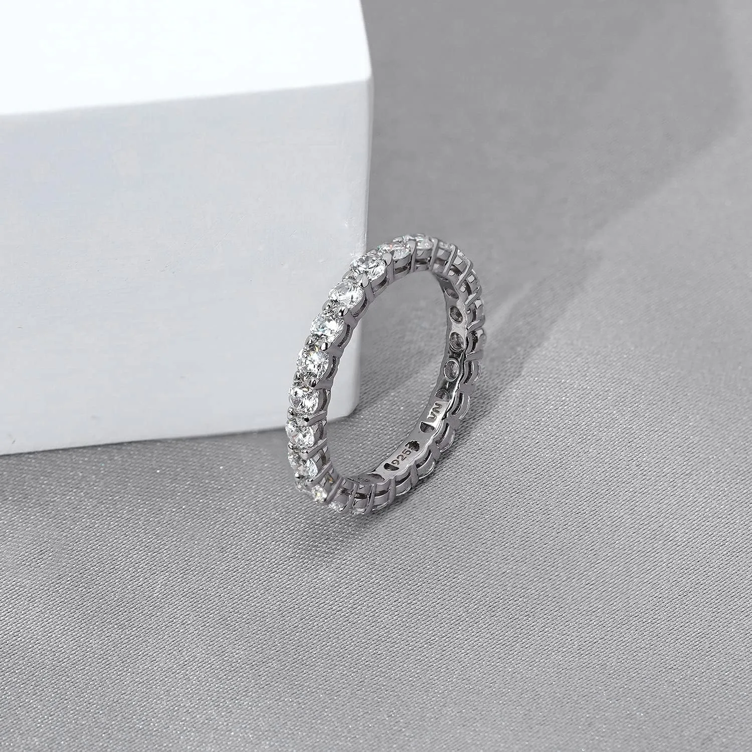 Amazon Essentials Platinum or Gold Plated Sterling Silver All-Around Band Ring set with Round Infinite Elements Cubic Zirconia (previously Amazon Collection)