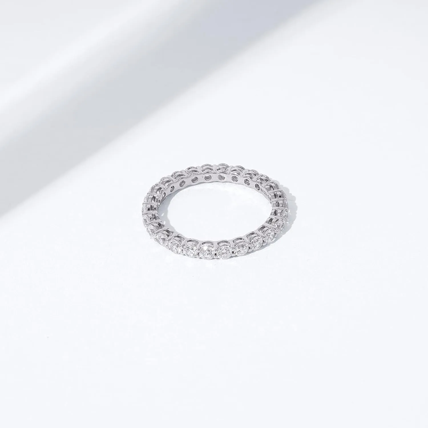 Amazon Essentials Platinum or Gold Plated Sterling Silver All-Around Band Ring set with Round Infinite Elements Cubic Zirconia (previously Amazon Collection)